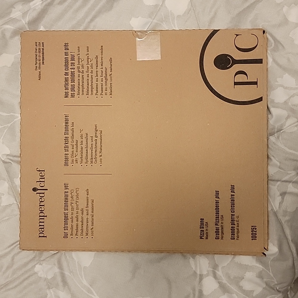 New in box, never opened, Large, pampered chef pizza stone